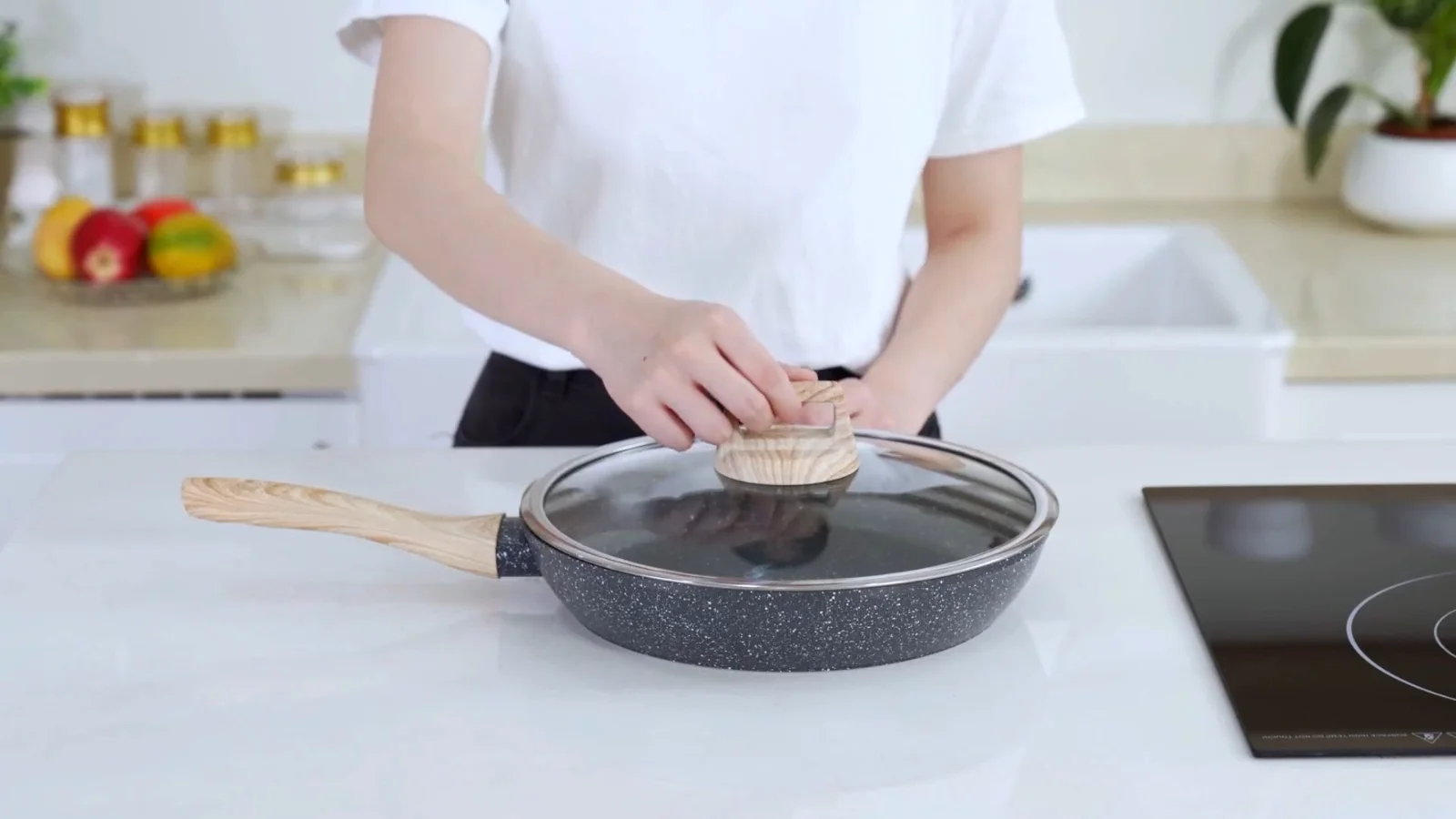A SODAY granite nonstick frying pan heating on an induction hob